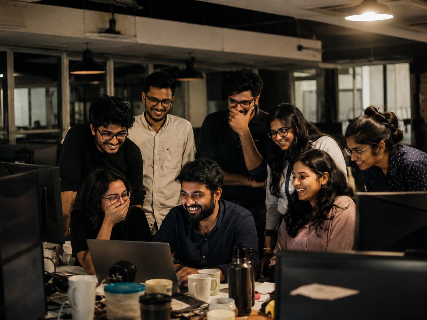 Work team standing together after a shared project